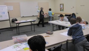 Kids building their family tree booklet at the library. Kids building their family tree booklet at the library.
